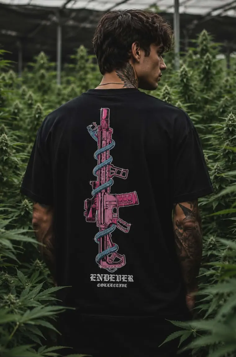 An operator in the field wearing the rifle-and-serpent back print.