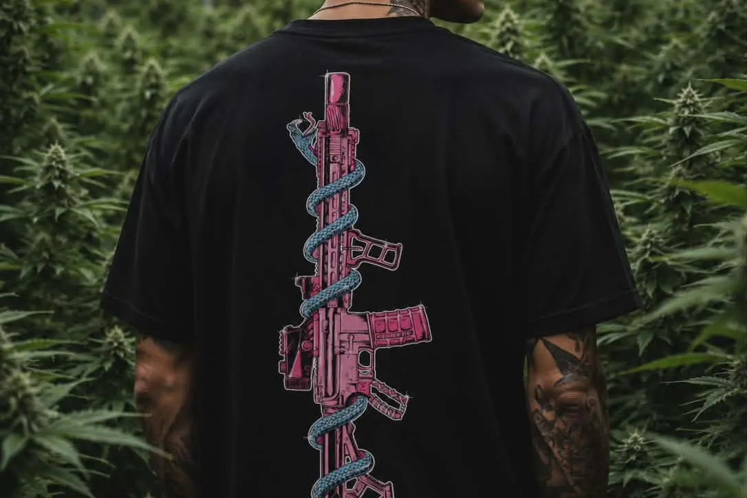 Standard Issue tee, rifle-and-serpent back print, worn in the field.