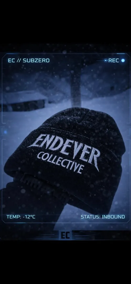 Cuffed beanie, faded black, embroidered Endever Collective mark in snow.